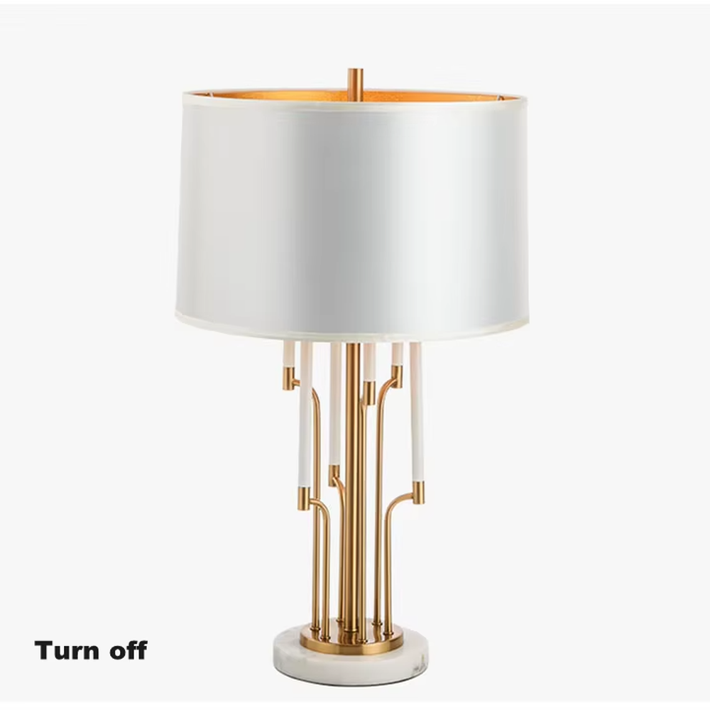 Luxury multi-pole metal table lamp (gold pole + white shade + marble base), warm light effect, creating an elegant and high-end light luxury space atmosphere.