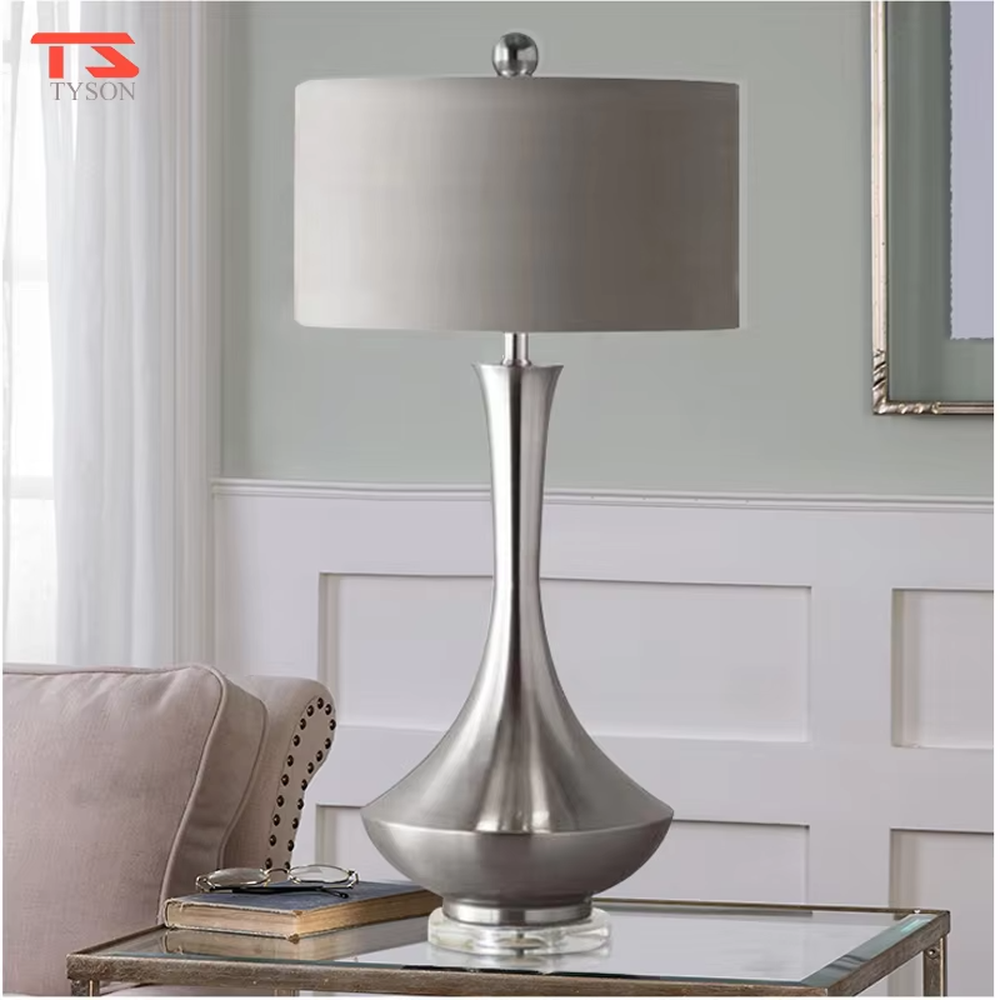 Modern minimalist silver bottle-shaped metal pole light beige fabric shade table lamp, warm light effect, creating an elegant light luxury home atmosphere.