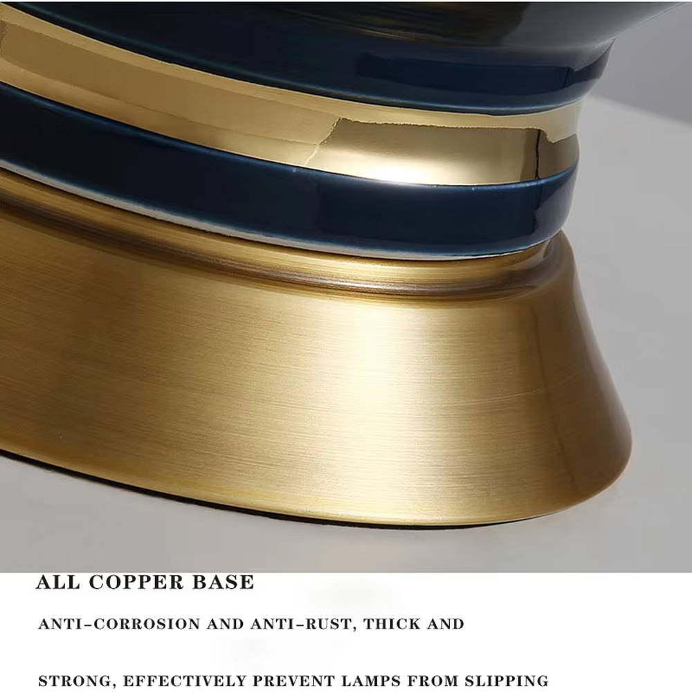 This is a light luxury European-style ceramic table lamp, with a dark blue ceramic base paired with gold metal decorations, and a light blue vertical-striped fabric lampshade edged with a gold ribbon, which has both lighting and decorative functions, suitable for bedroom nightstands, living room side tables, hotel guest rooms and other spaces.