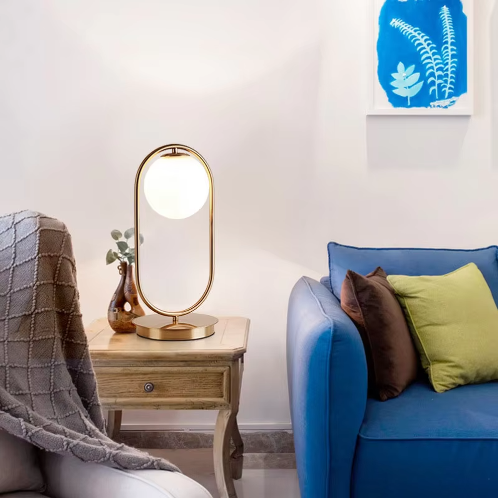 Minimalist gold ring glass ball table lamp (gold ring stand + milk white glass ball), warm light effect, creating a simple and high-end light luxury home atmosphere.