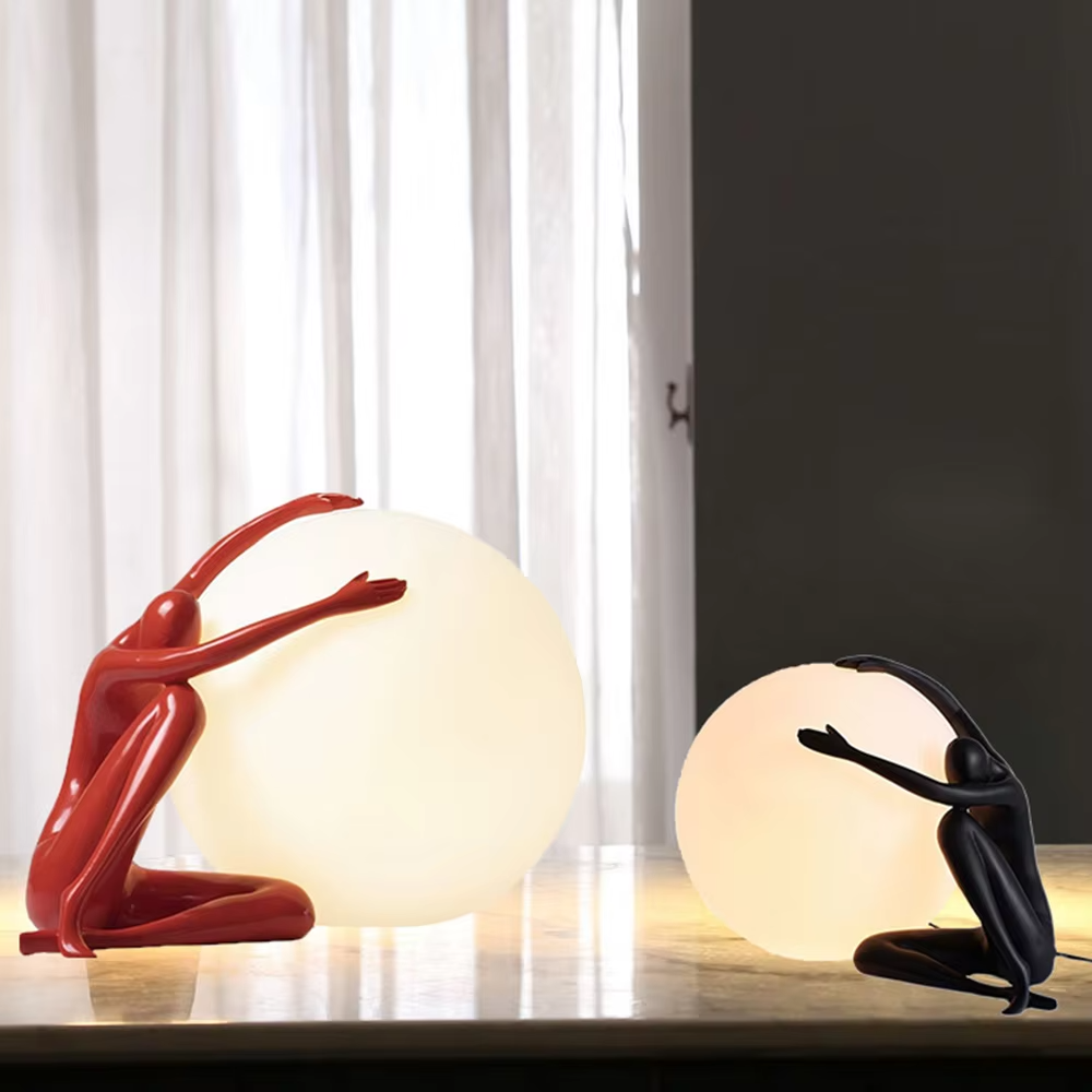 Artistic red sculpture humanoid lifting spherical soft light table lamp, warm light effect, creating a personalized artistic space atmosphere.