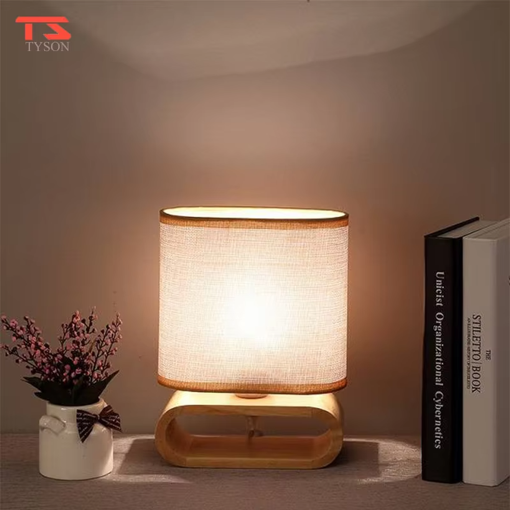 This is a Nordic minimalist style wooden table lamp, featuring a curved solid wood stand paired with a linen fabric lampshade. It emits soft and warm light, serving both lighting and decorative purposes, suitable for bedroom nightstands, living room side tables, studies, homestay guest rooms and other scenarios.