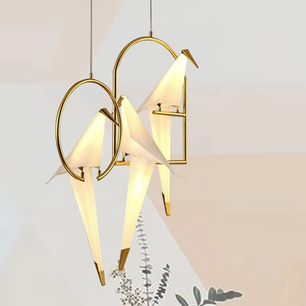 This is a modern light luxury origami crane-shaped floor lamp, featuring a gold metal stand paired with a translucent paper art lamp body. The lamp body is as dynamic and soft as an origami crane, serving both lighting and artistic decoration purposes, suitable for bedrooms, light luxury living rooms, hotel guest rooms, showrooms and other scenarios.