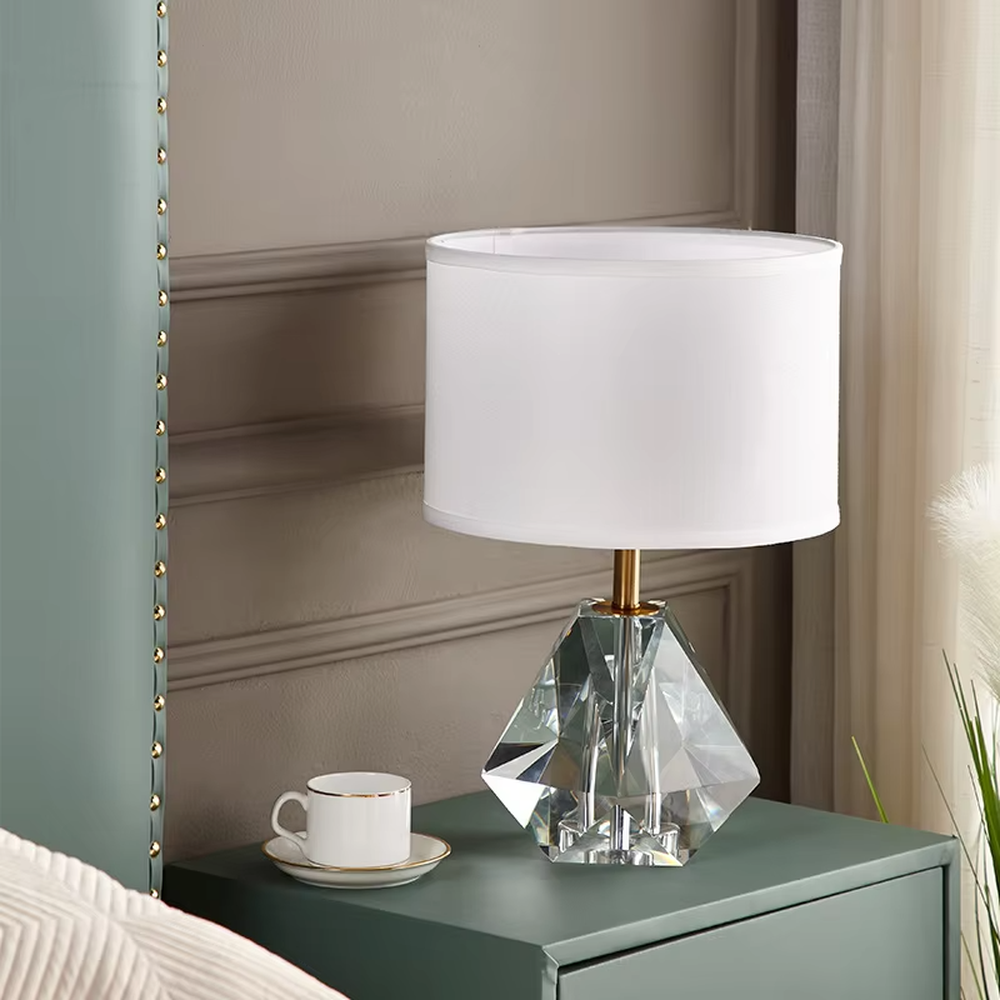 Light luxury multi-faceted cut crystal base table lamp (white shade + gold trim), warm light effect, creating a brilliant and exquisite space atmosphere.