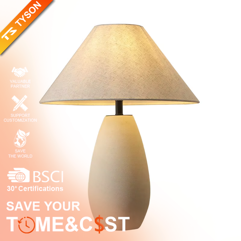 This is a wabi-sabi style minimalist table lamp, featuring an off-white frosted ceramic base paired with a linen fabric lampshade. The light is soft and warm, serving both lighting and decorative purposes, suitable for scenarios pursuing a warm and relaxed feeling such as bedroom nightstands, homestay guest rooms, Japanese-style tea rooms, and wabi-sabi style living rooms.