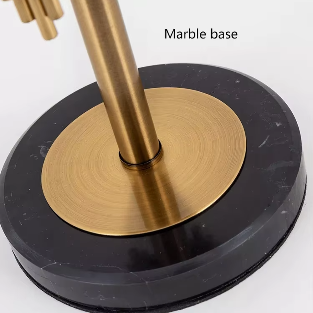 Modern light luxury black-gold striped decorative table lamp, golden metal striped base + white shade with gold trim + warm light effect, creating an exquisite luxurious home atmosphere.