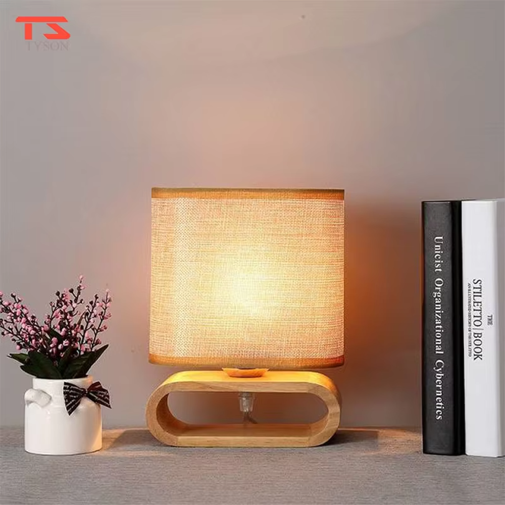 This is a Nordic minimalist style wooden table lamp, featuring a curved solid wood stand paired with a linen fabric lampshade. It emits soft and warm light, serving both lighting and decorative purposes, suitable for bedroom nightstands, living room side tables, studies, homestay guest rooms and other scenarios.