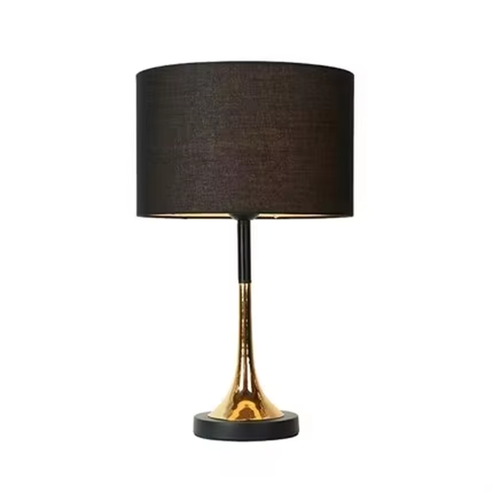 This modern light luxury table lamp features a black fabric cylindrical lampshade, paired with a black and gold contrasting metal lamp pole. The lower part is a trumpet-shaped gold metal design, and the base is black. The overall style is simple and elegant, with soft, non-glaring light, serving both lighting and decorative purposes, suitable for bedrooms, studies, living rooms and other spaces.

