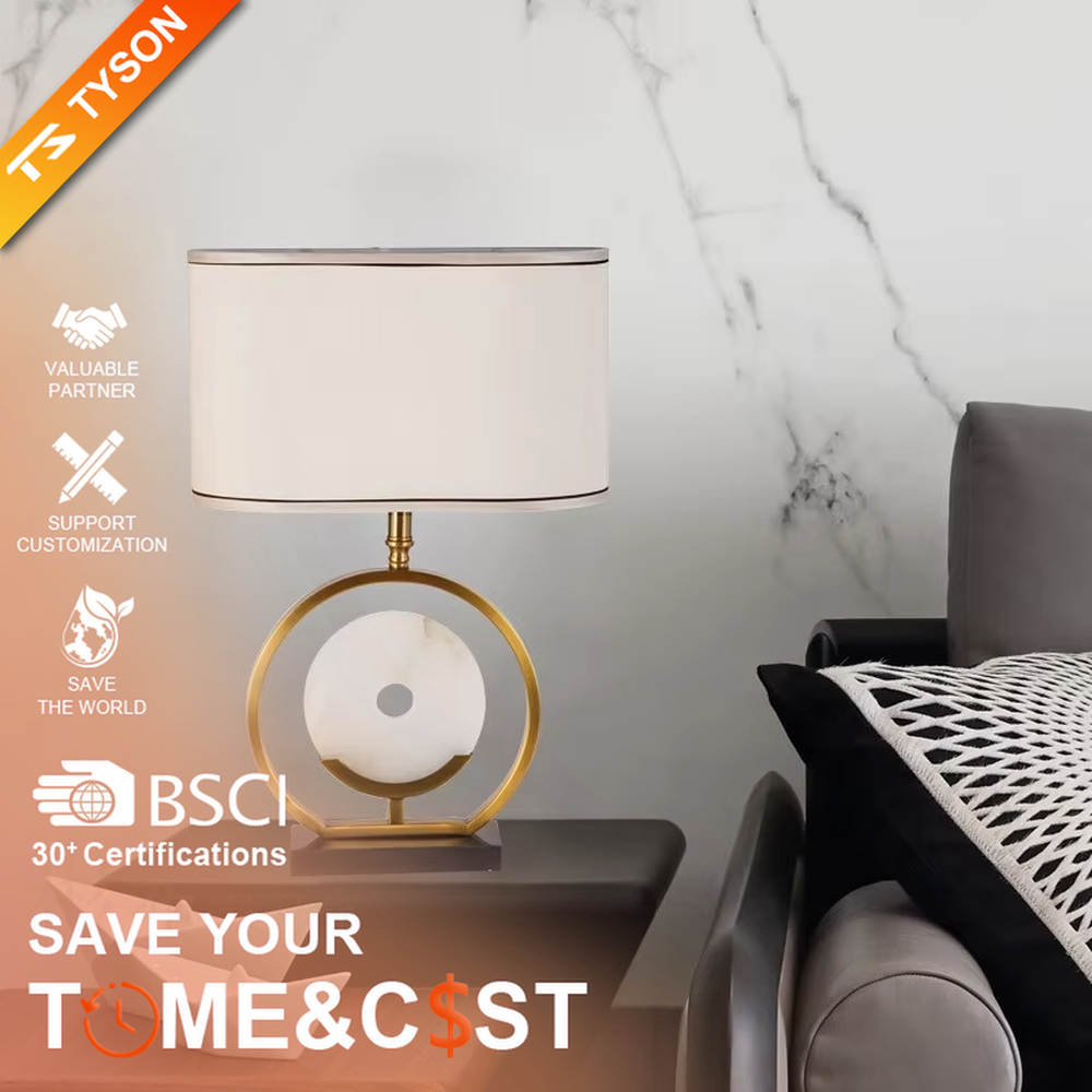 Modern light luxury gold ring white spherical base beige trimmed fabric shade table lamp, warm light effect, creating an elegant home atmosphere.