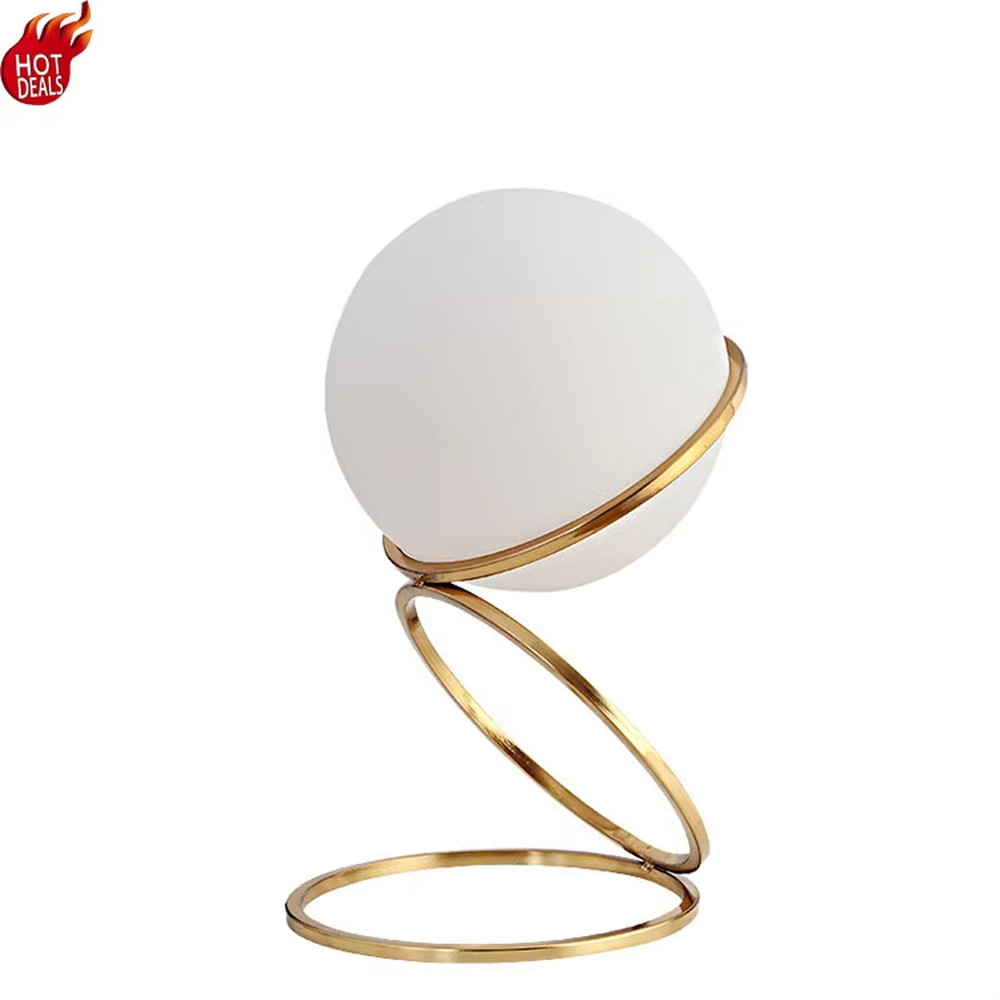 This is a light luxury spiral metal stand table lamp, with a gold spiral design paired with a white spherical frosted lampshade, featuring both decorative and lighting functions, ideal for modern indoor scenarios such as living room side tables and bedroom nightstands.
