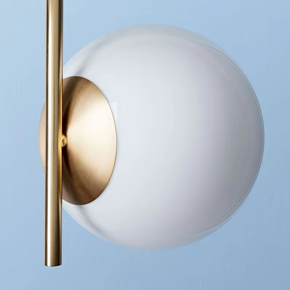 This modern light luxury double-ball table lamp features a gold metal stand, paired with milky white glass ball lampshades and a white marble base, with a simple and elegant staggered double-ball layout, serving both lighting and decorative purposes, ideal for living room side tables, bedroom bedside tables, light luxury homestays and other spaces.