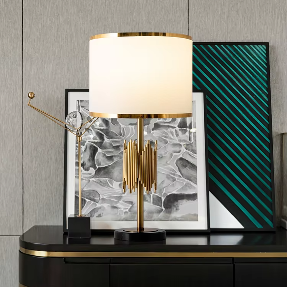 Modern light luxury black-gold striped decorative table lamp, golden metal striped base + white shade with gold trim + warm light effect, creating an exquisite luxurious home atmosphere.