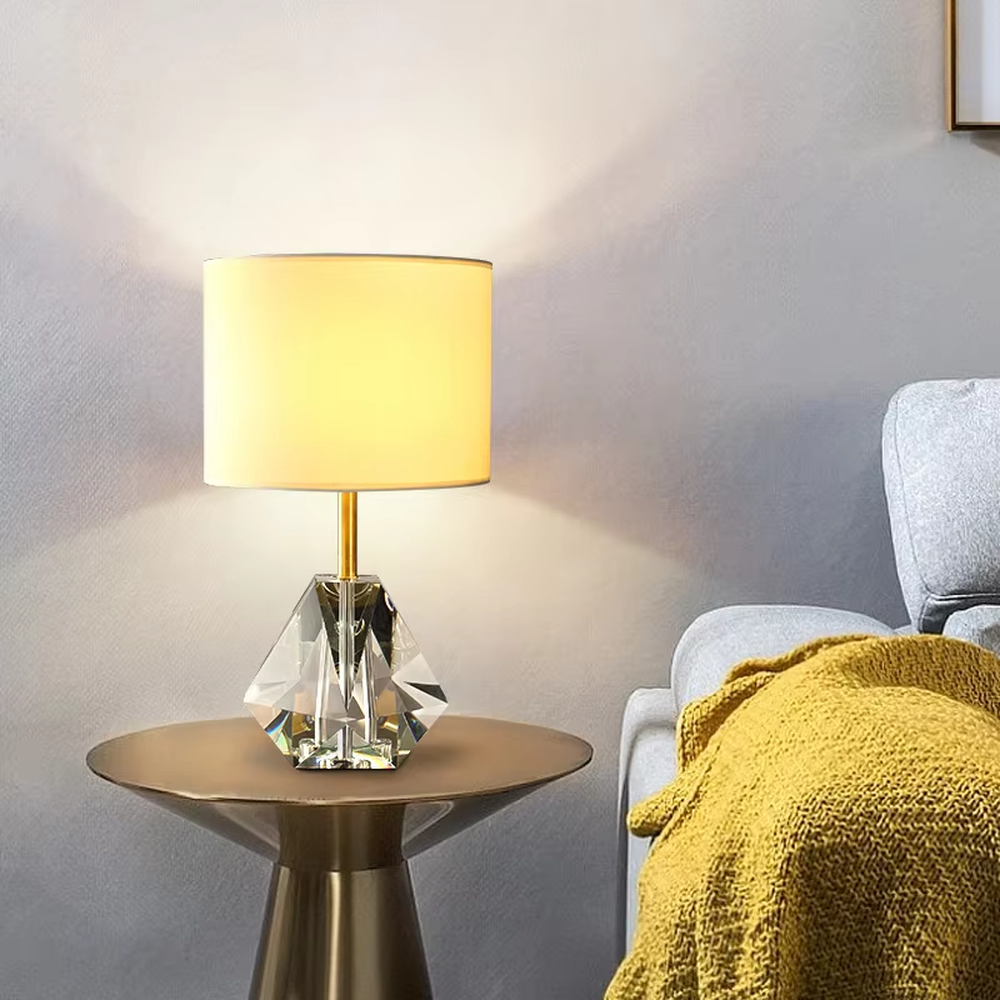 Light luxury multi-faceted cut crystal base table lamp (white shade + gold trim), warm light effect, creating a brilliant and exquisite space atmosphere.