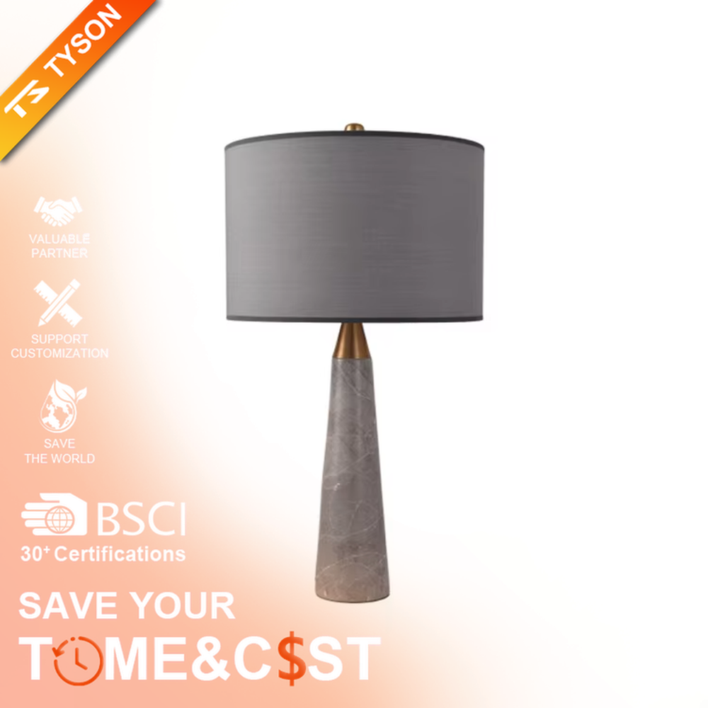 Light luxury marble cone table lamp, with a grey natural marble base, gold metal connection, off-white fabric lampshade with black trim, providing soft and warm light, designed to enhance the delicate texture of spaces, suitable for bedroom nightstands, living room side tables, modern light luxury homes and hotel guest rooms, etc.