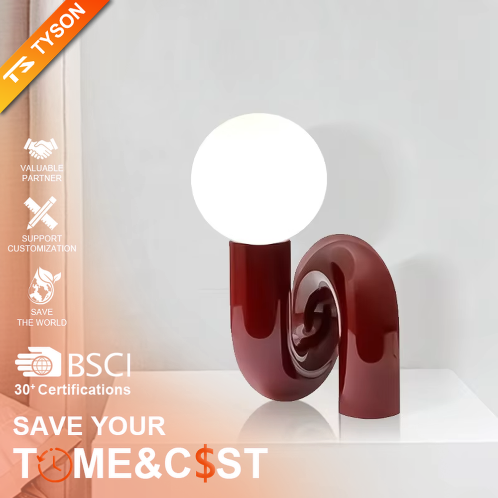 This art table lamp features a spiral S-shaped stand made of glossy wine-red material, paired with a milky white spherical lampshade, with a vivid and retro shape, serving both lighting and decorative purposes, ideal for bedrooms, living rooms, internet-famous shops and other spaces.