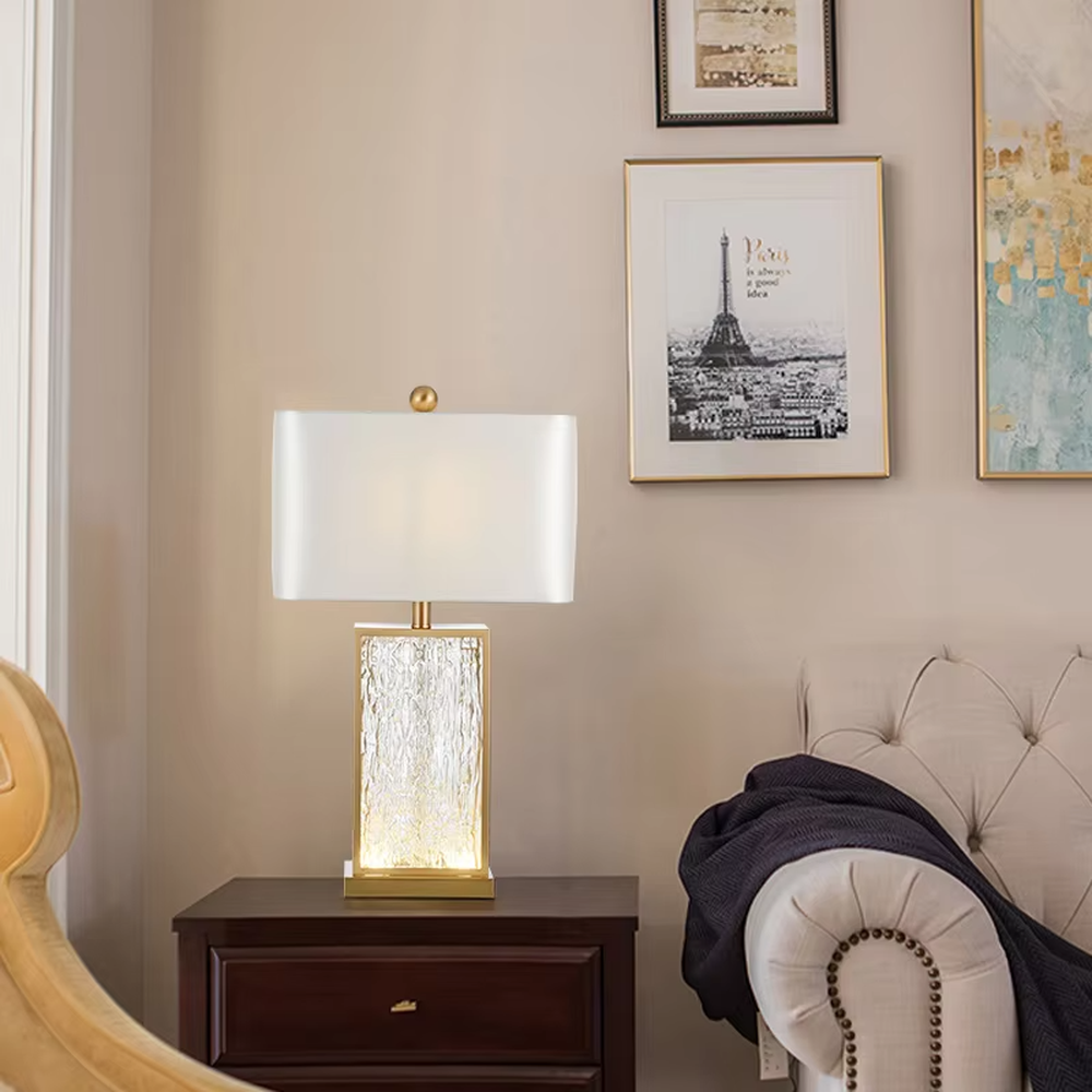 Light luxury golden frame ice-textured glass square table lamp (satin white shade), warm light effect, creating an exquisite and high-end space atmosphere.