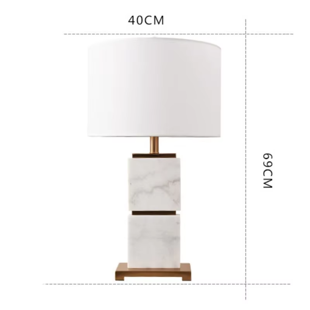 Light luxury stacked marble table lamp, natural marble base with gold metal connections, rectangular fabric lampshade for soft and eye-protective lighting, designed to enhance space texture, suitable for bedroom nightstands, living room side tables, hotel guest rooms, etc.