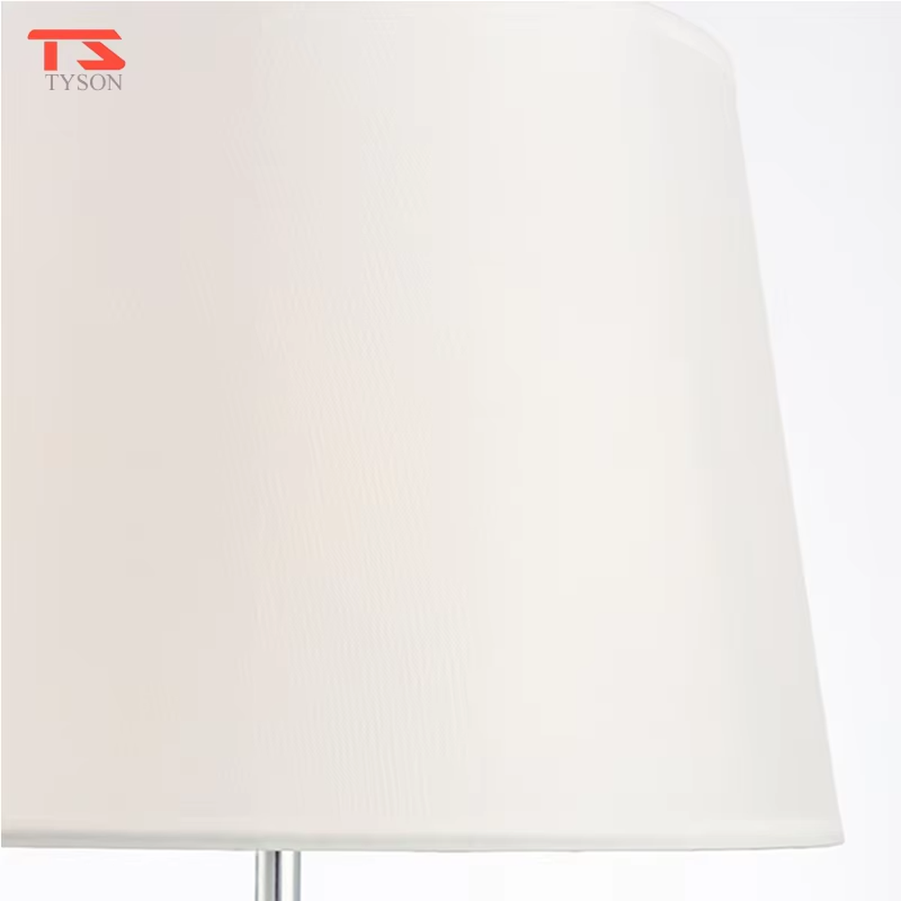 Modern art pink waterdrop glass base beige fabric shade table lamp, warm light effect, creating an elegant artistic atmosphere.