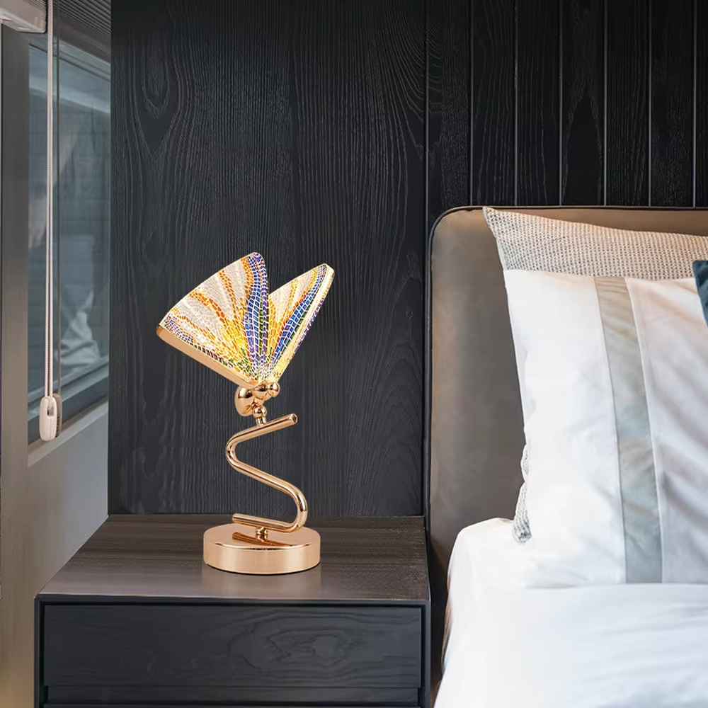 This light luxury modern table lamp features a gold S-shaped metal stand, paired with a ginkgo leaf-shaped textured translucent lampshade, supports angle adjustment, serves both lighting and decorative purposes, ideal for light luxury spaces such as bedroom bedside tables, living room side tables, and hotel guest rooms.