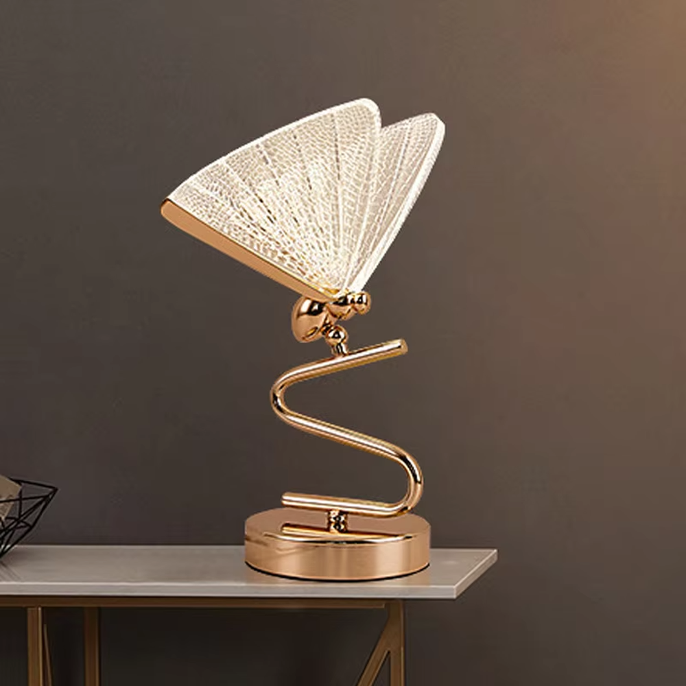 This light luxury modern table lamp features a gold S-shaped metal stand, paired with a ginkgo leaf-shaped textured translucent lampshade, supports angle adjustment, serves both lighting and decorative purposes, ideal for light luxury spaces such as bedroom bedside tables, living room side tables, and hotel guest rooms.