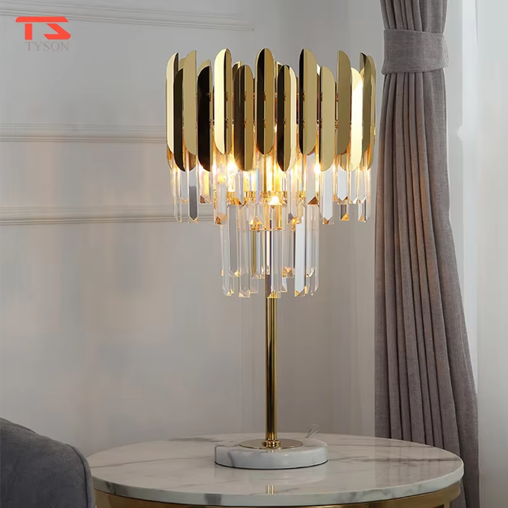 Light luxury crystal metal table lamp, with gold metal sheets and multi-layer crystal pendants, featuring brilliant and gorgeous light refraction, designed to enhance the luxurious atmosphere of spaces, suitable for high-end scenarios such as bedroom nightstands, living room entrances, and hotel guest rooms
