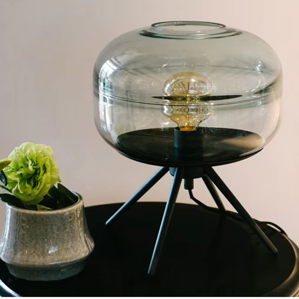 Light luxury dark green glass ball table lamp (dark green double-layer glass ball + black triangular stand), warm light effect, creating a fresh and high-end home atmosphere.