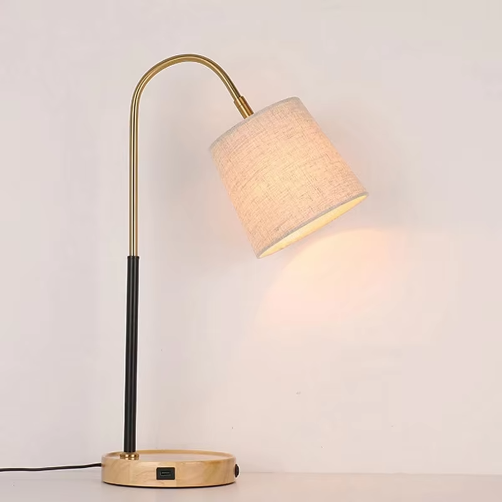 Light luxury wood-base curved arm table lamp (log base + black-gold curved arm + linen lampshade), warm light effect, creating a warm and high-end home atmosphere.
