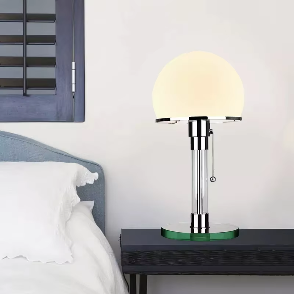 Modern light luxury adjustable-height mushroom table lamp, with a milky white spherical lampshade paired with a chrome-plated + transparent acrylic adjustable-height lamp pole, featuring a pull-chain switch, and a green acrylic base, emitting soft and even light, combining decorativeness and practicality, suitable for lighting and decoration in spaces such as bedroom nightstands, study desks, and living room side tables.
