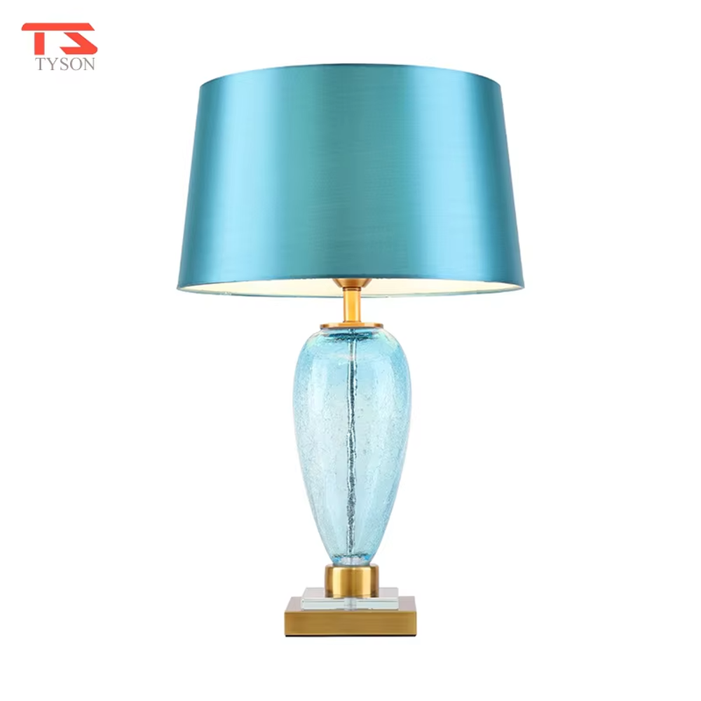 Light luxury lake blue glass bottle-shaped table lamp (satin fabric shade + gold trim), warm light effect, creating a fresh and elegant space atmosphere.