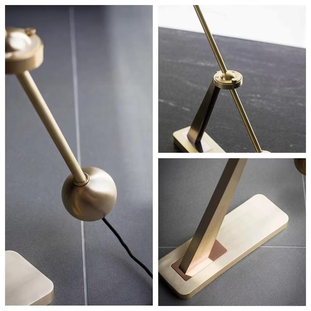 Modern minimalist golden adjustable table lamp (metal pole + cylindrical lampshade), warm light effect, creating a high-end practical office/home space atmosphere.