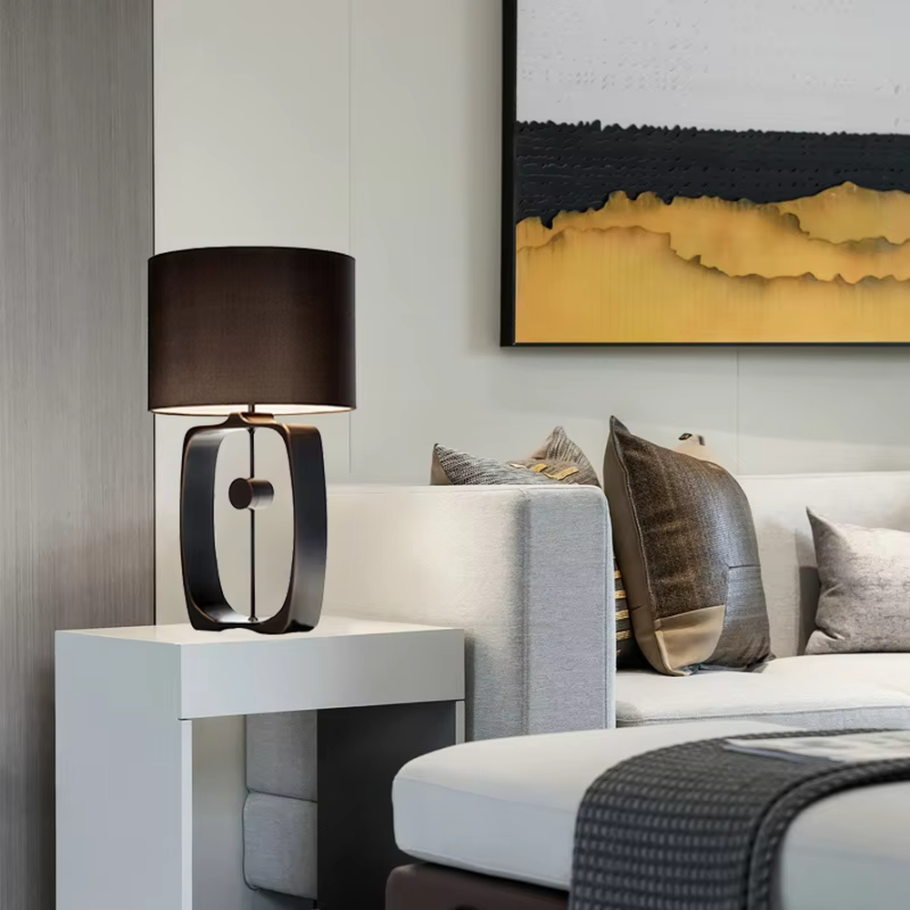 Modern Minimalist Geometric Metal Table Lamp, Black Cylindrical Fabric Lampshade, Hollow Ring Black Metal Lamp Body, Serves Both Lighting and Decorative Purposes, Ideal for Bedrooms, Living Rooms, Studies, Modern Office Spaces, etc.
