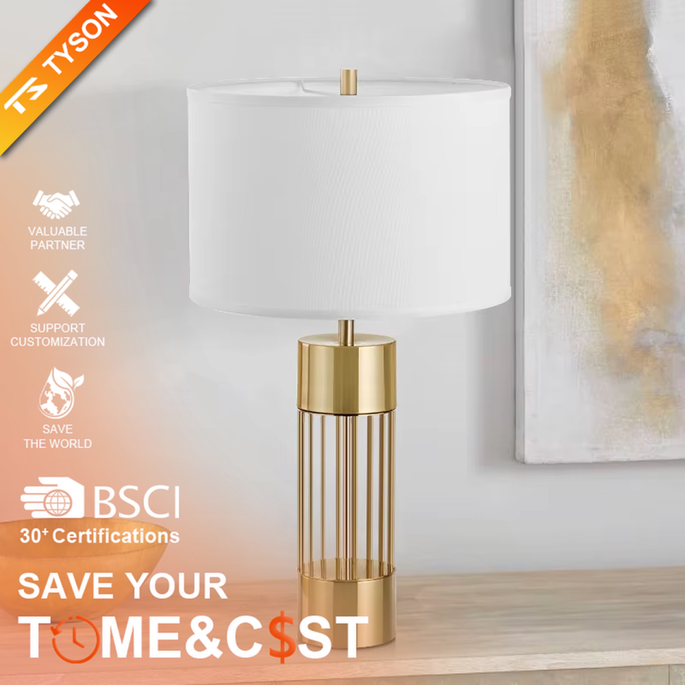 This light luxury table lamp features a gold metal hollow vertical strip column base, paired with a white fabric cylindrical lampshade and a top gold spherical decoration, with a simple and elegant shape, serving both lighting and decorative purposes, ideal for bedroom bedside tables, living room side tables, light luxury homestays and other spaces.