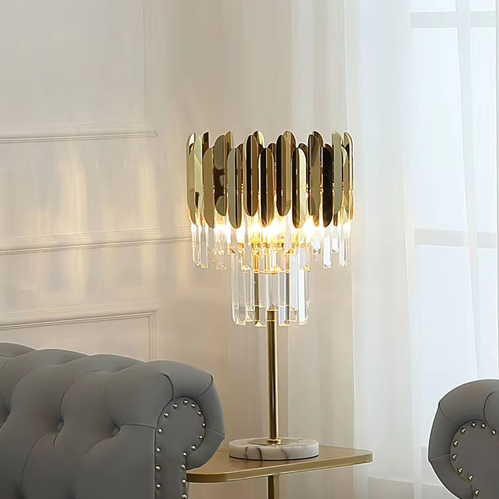 Light luxury gold sheet crystal table lamp (gold metal sheet lampshade + crystal pendants + marble base), warm light effect, creating a luxurious and high-end home atmosphere.