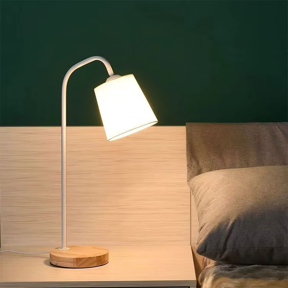 Nordic minimalist eye-protection table lamp, solid wood base paired with white bendable iron lamp pole and fabric lampshade, soft and eye-protective light, used for lighting in desks, nightstands and other areas, suitable for Nordic-style homes, office areas, homestay guest rooms, etc.