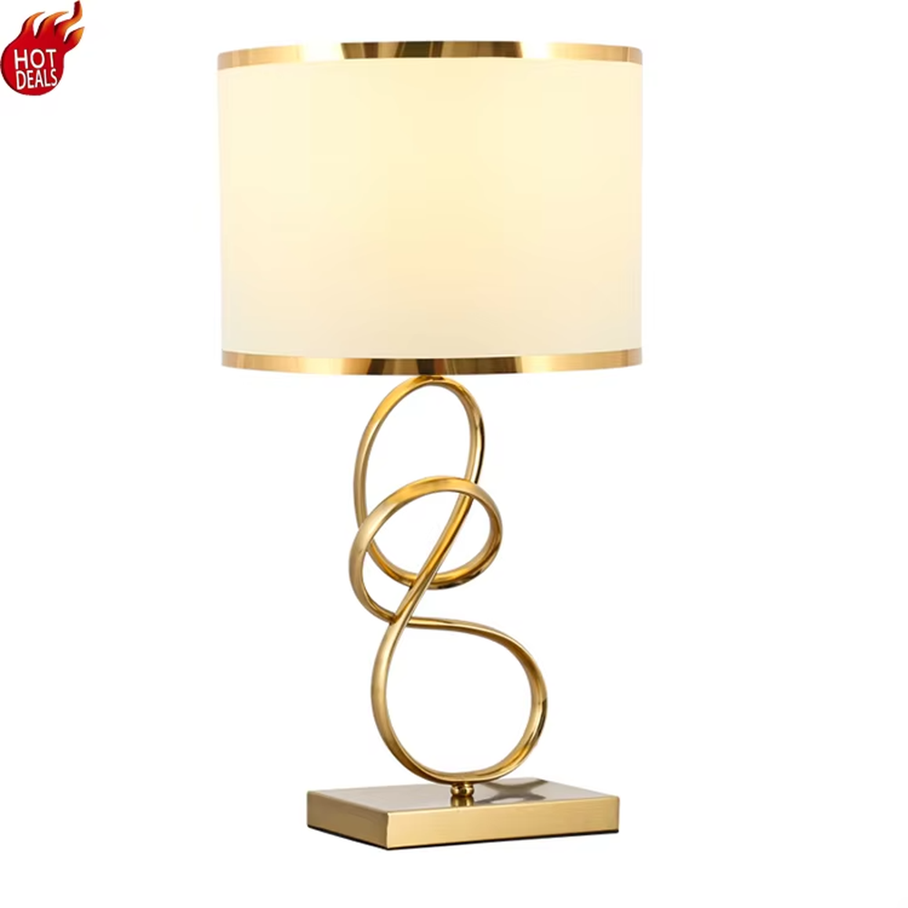 Modern light luxury twisted line metal table lamp, with a gold twisted line lamp pole paired with a beige fabric lampshade (with gold trim on the edge), a square gold base, emitting soft and warm light, combining decorativeness and practicality, suitable for lighting and decoration in spaces such as bedroom nightstands, living room side tables, and studies.