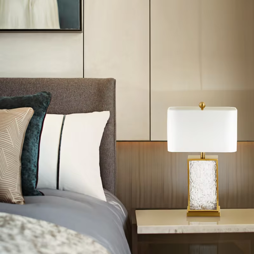 Light luxury golden frame ice-textured glass square table lamp (satin white shade), warm light effect, creating an exquisite and high-end space atmosphere.