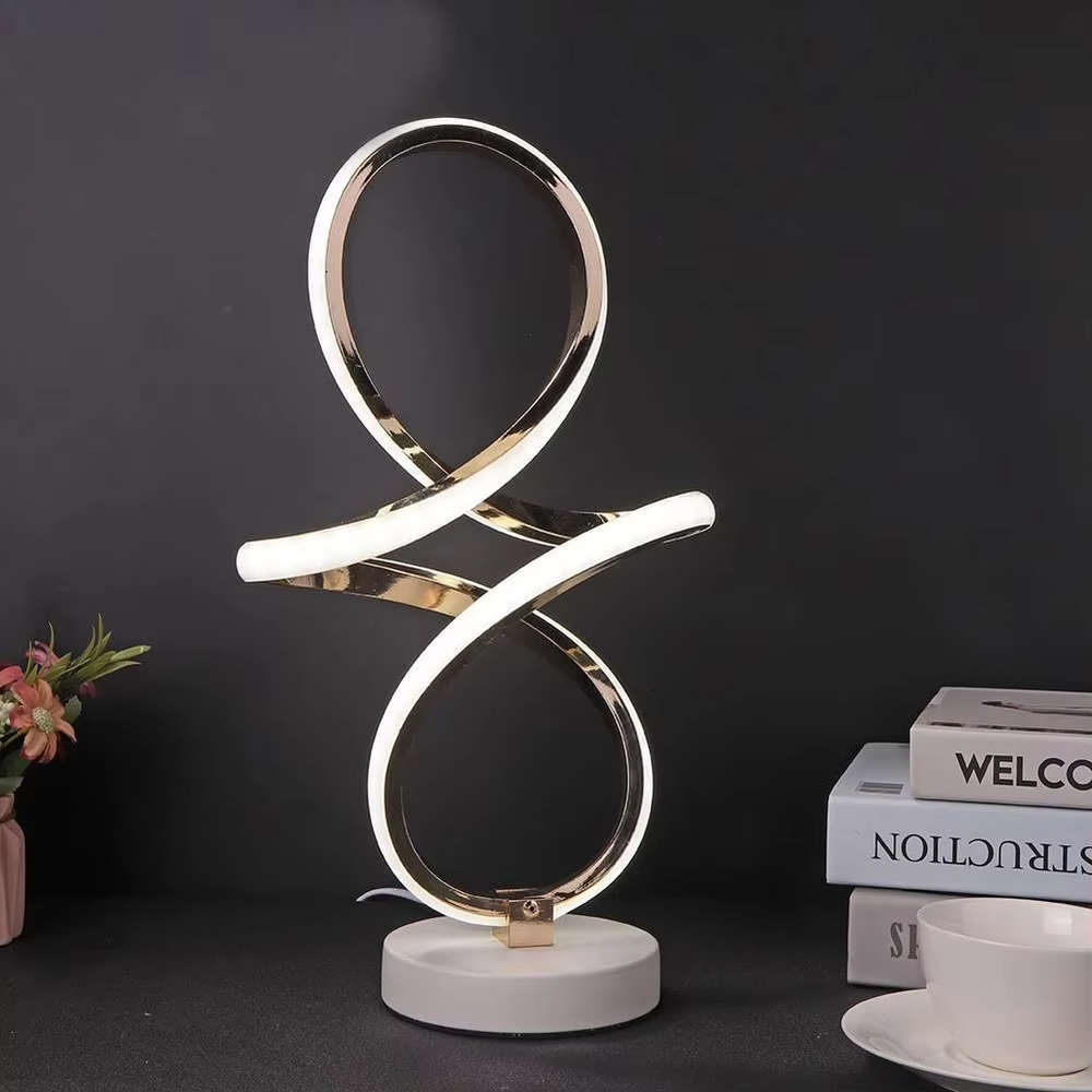 This light luxury art table lamp features a "8"/infinity symbol shape made of gold metal, with embedded LED light strips and a white marble base, serving both lighting and decorative purposes, ideal for living room side tables, bedroom bedside tables, light luxury homestays and other spaces.