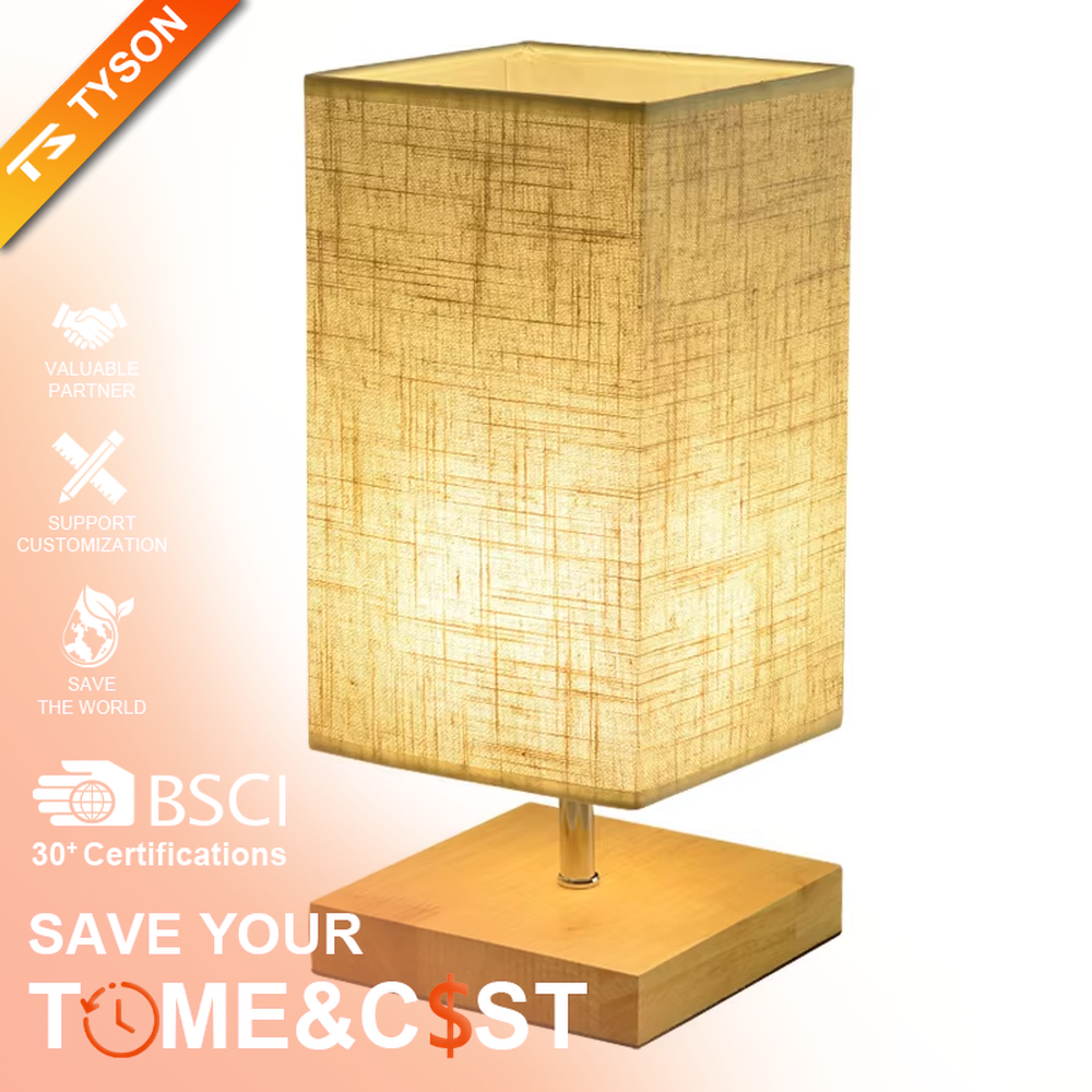 This is a minimalist square fabric table lamp, featuring a light beige linen lampshade paired with a black solid wood base. It emits soft and warm light, serving both lighting and decorative purposes, suitable for bedroom nightstands, desks, homestay guest rooms, living room side tables and other scenarios.