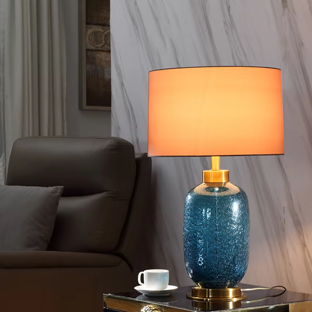 Light luxury cracked blue glaze table lamp (blue glaze body + gradient fabric shade + gold accessories), warm light effect, creating an elegant and high-end home atmosphere.