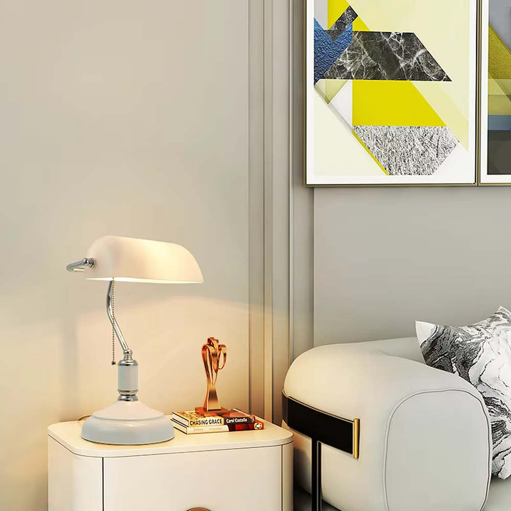 Vintage industrial-style green shade brass adjustable table lamp, semi-circular green shade + brass metal stand + pull chain switch, soft warm light creates vintage atmosphere.