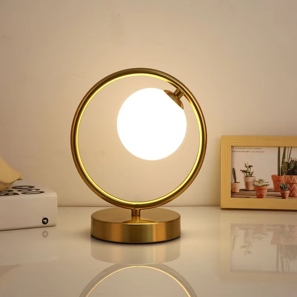This is a modern minimalist metal frame table lamp, with a black oval metal stand paired with a white spherical frosted lampshade, featuring a simple and elegant design, both decorative and lighting functions, ideal for modern indoor scenarios such as desks and nightstands.