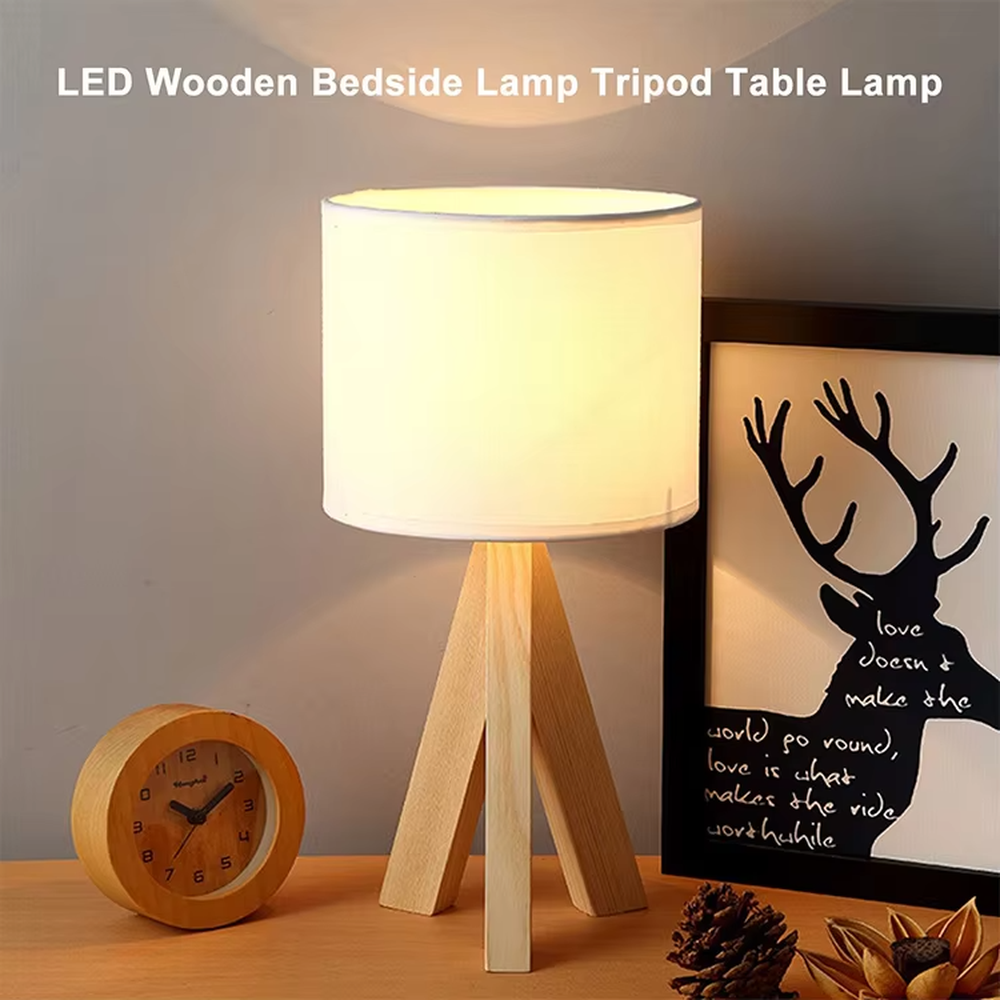 Nordic wooden tripod table lamp (log tripod stand + fabric lampshade), warm light effect, creating a natural and warm home atmosphere.
