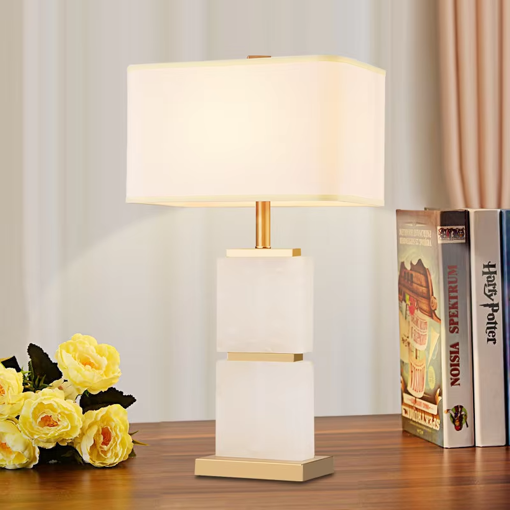Light luxury stacked marble table lamp, featuring natural marble blocks stacked with a gold metal frame and a rectangular fabric lampshade, providing soft and eye-protective lighting, designed to enhance space texture, suitable for bedroom nightstands, living room side tables, hotel guest rooms, etc.