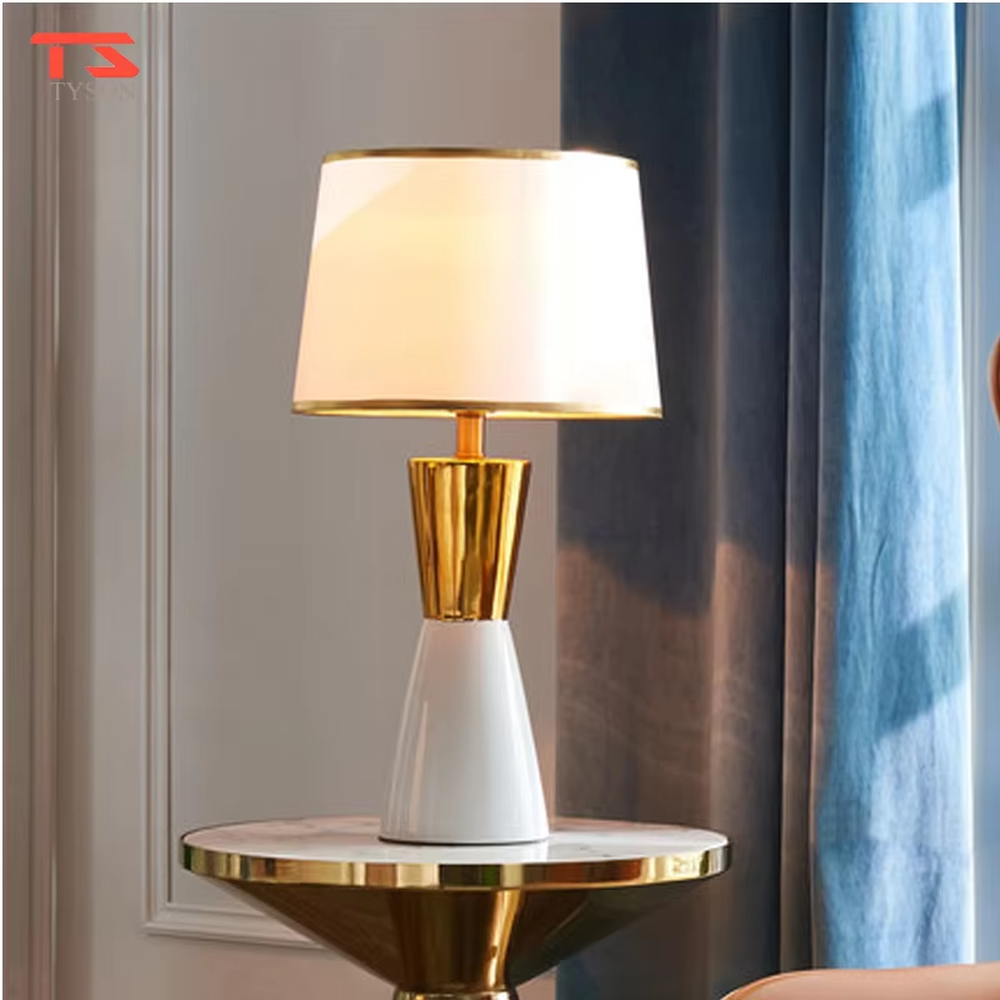This is a light luxury black-gold table lamp, with a black fabric lampshade edged with gold trim, and a cone-shaped base with a black-gold color block design, featuring both decorative and lighting functions, ideal for high-end indoor scenarios such as bedroom nightstands and living room side tables.