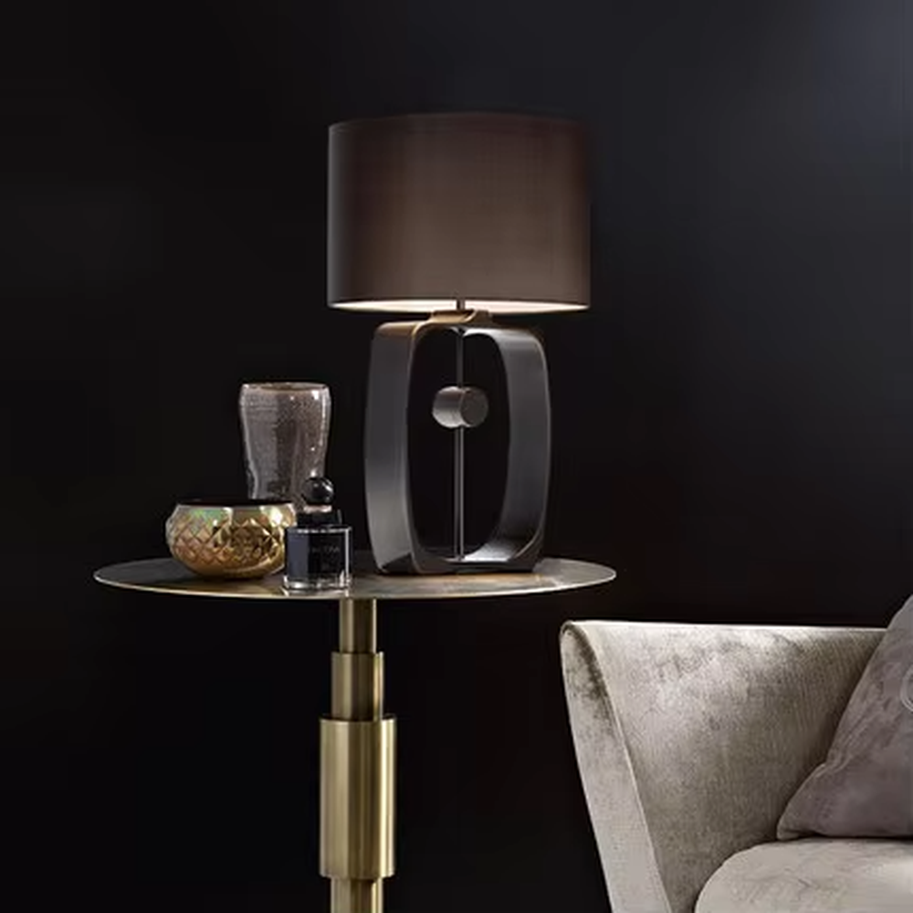 Modern Minimalist Geometric Metal Table Lamp, Black Cylindrical Fabric Lampshade, Hollow Ring Black Metal Lamp Body, Serves Both Lighting and Decorative Purposes, Ideal for Bedrooms, Living Rooms, Studies, Modern Office Spaces, etc.