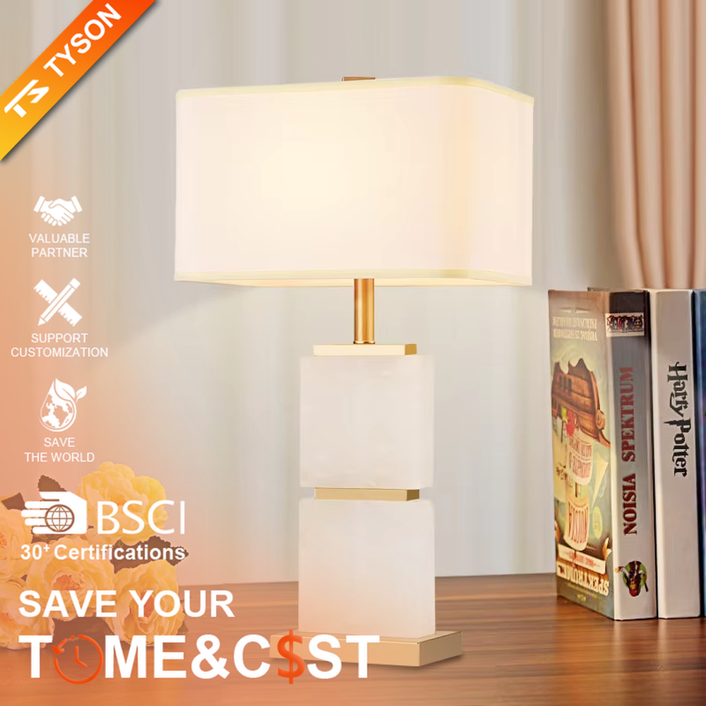 Light luxury stacked marble table lamp, natural marble base with gold metal connections, rectangular fabric lampshade for soft and eye-protective lighting, designed to enhance space texture, suitable for bedroom nightstands, living room side tables, hotel guest rooms, etc.
