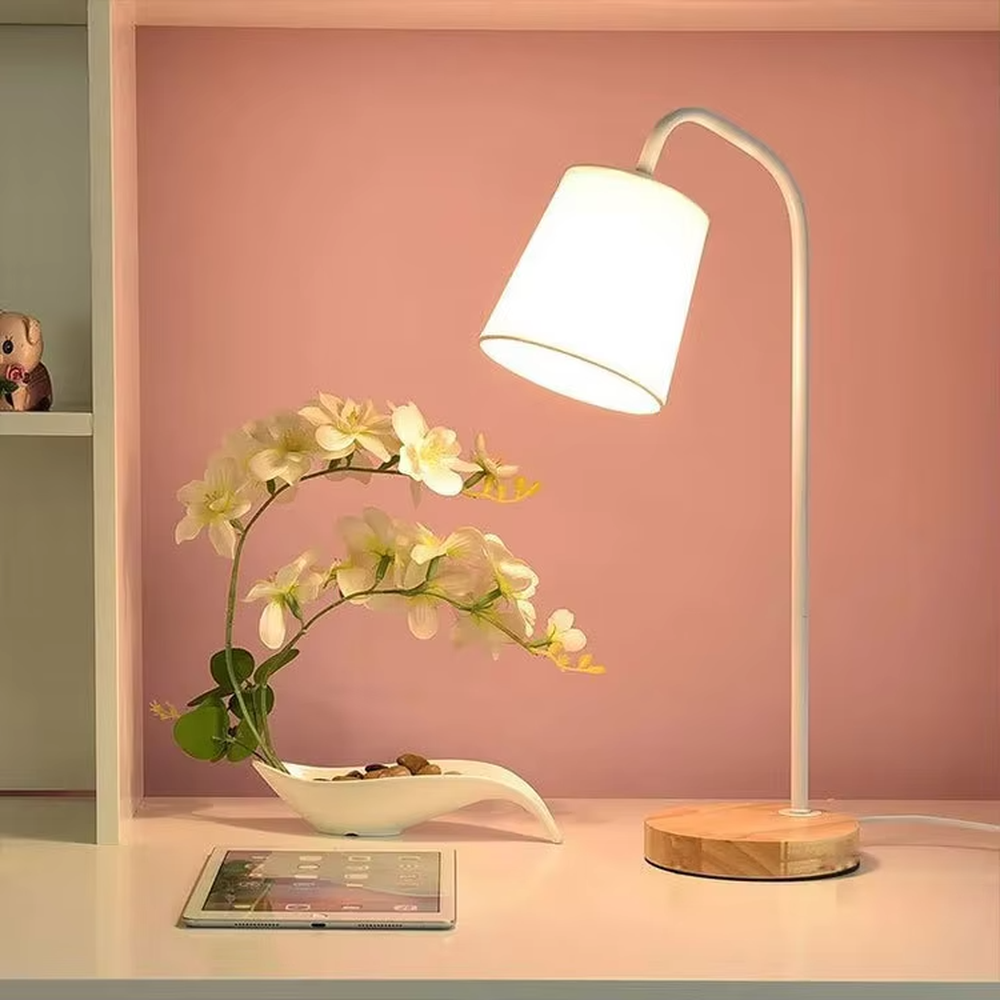 Nordic minimalist eye-protection table lamp, solid wood base paired with white bendable iron lamp pole and fabric lampshade, soft and eye-protective light, used for lighting in desks, nightstands and other areas, suitable for Nordic-style homes, office areas, homestay guest rooms, etc.