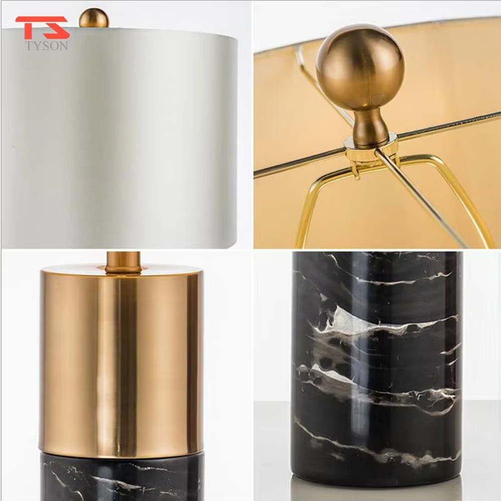 This is a light luxury marble-metal splicing table lamp, with a white fabric lampshade paired with a base made of gold metal and gray marble, accented with an orange decorative ball on top, featuring both decorative and lighting functions, ideal for high-end indoor scenarios such as bedroom nightstands and living room side tables.