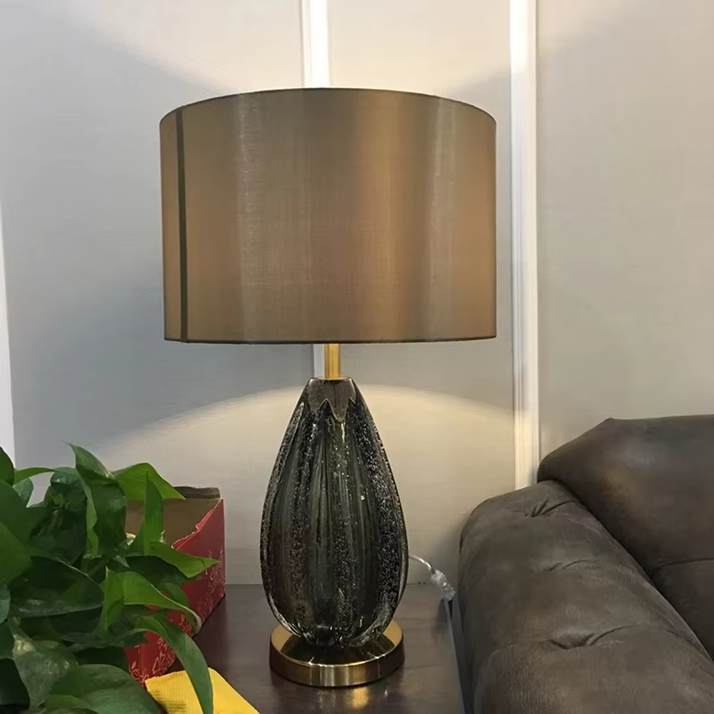 Light luxury black crystal fabric shade table lamp (black crystal texture base + coffee fabric shade), warm light effect, creating a calm and high-end home atmosphere.