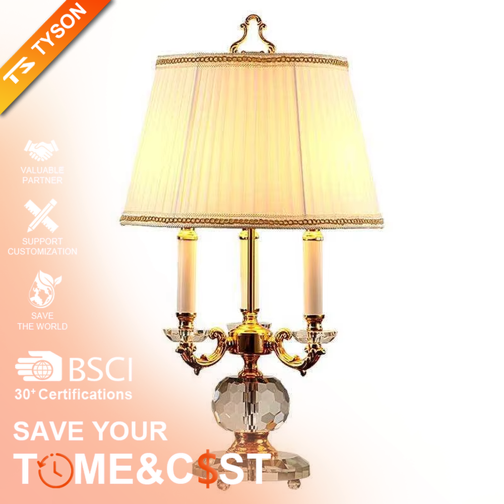 This European court-style table lamp features a carved lamp frame made of glossy gold metal, paired with a crystal ball base and a pleated fabric lampshade (trimmed with gold edging). It presents a luxurious and retro texture, with soft and warm light, serving both lighting and decorative purposes, suitable for European-style bedrooms, villa guest rooms and other spaces.